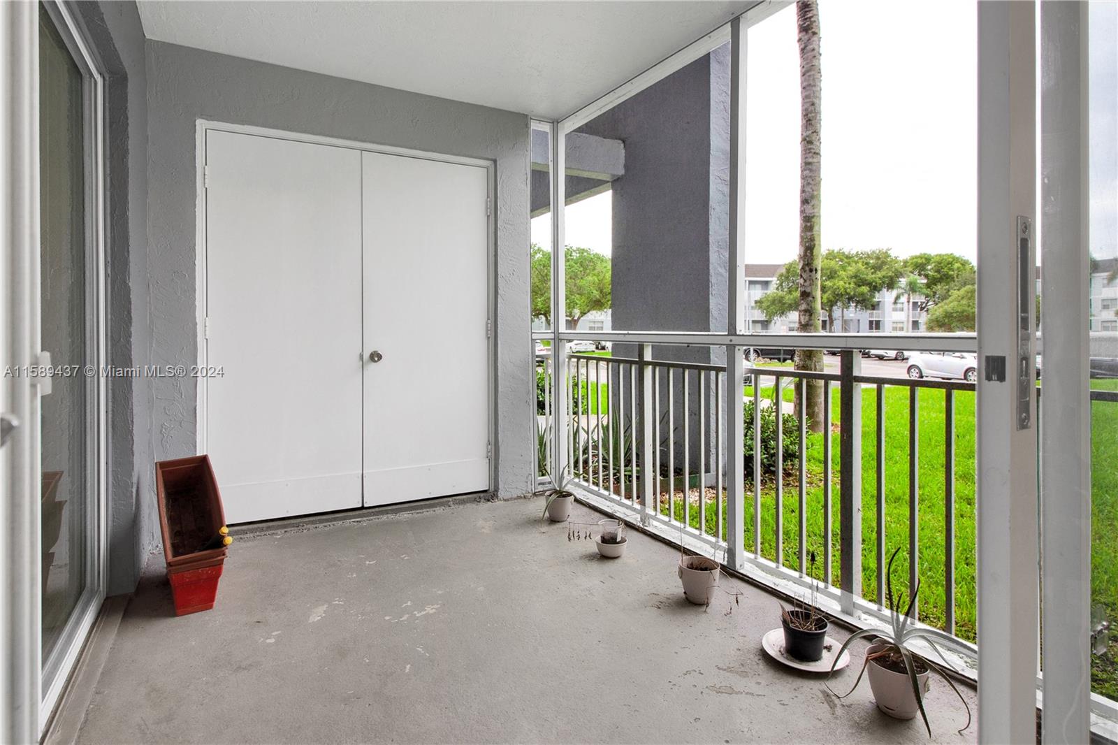 8650 Southwest 212th Street, Unit 101 Cutler Bay, FL 33189 - Photo 20 of 29 a view of an empty room with windows