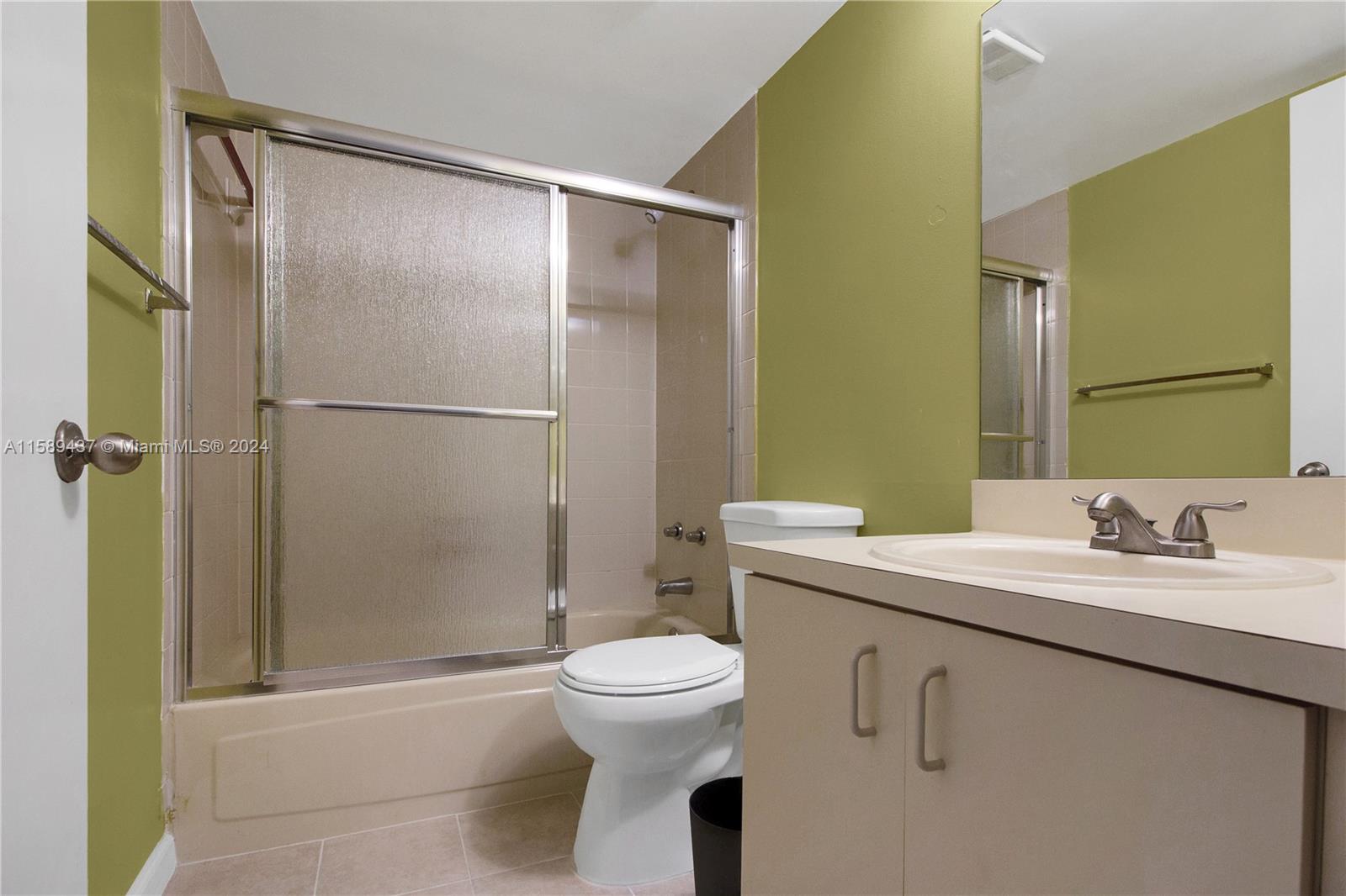 8650 Southwest 212th Street, Unit 101 Cutler Bay, FL 33189 - Photo 23 of 29 a bathroom with a sink toilet and shower