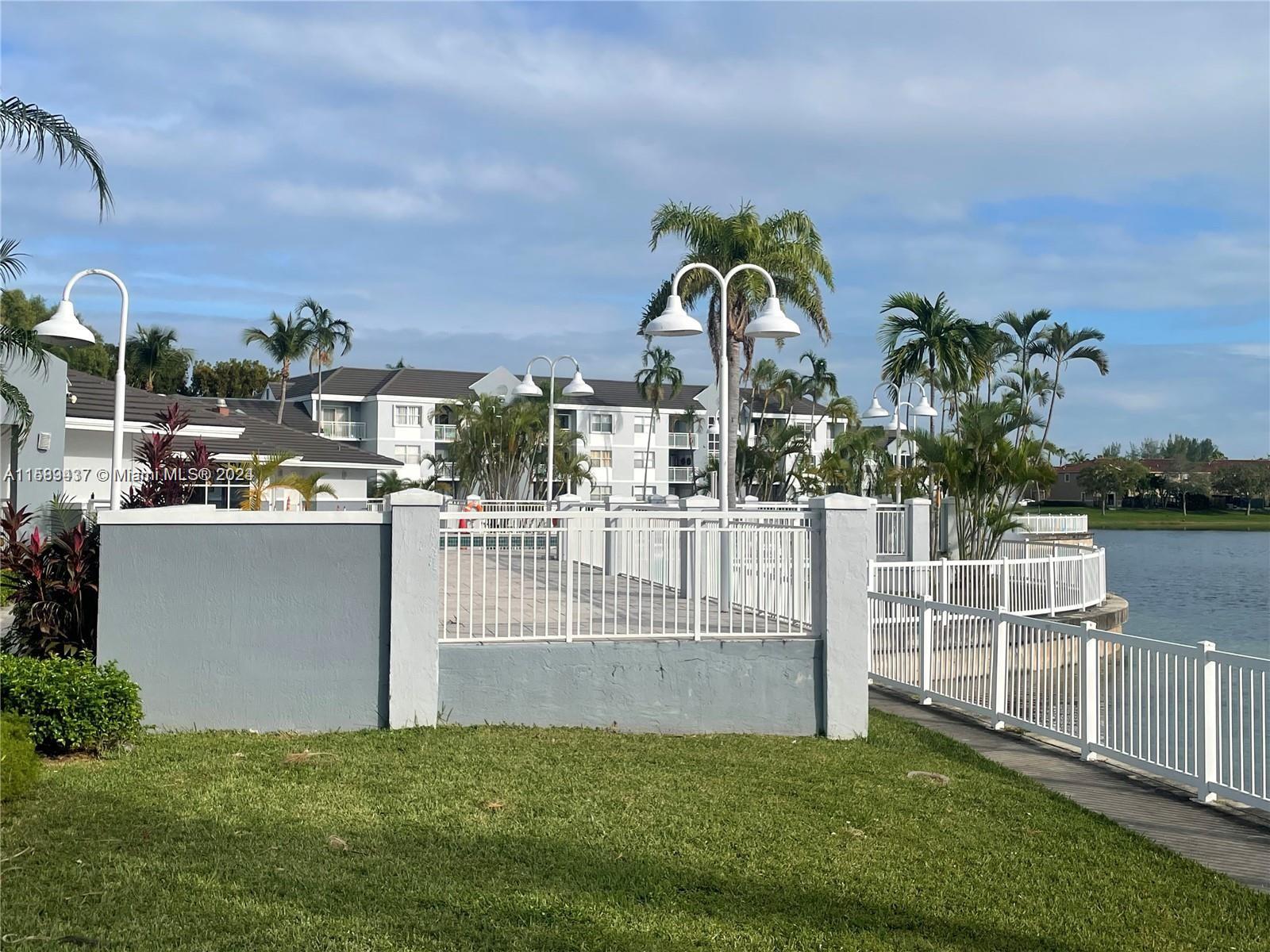 8650 Southwest 212th Street, Unit 101 Cutler Bay, FL 33189 - Photo 4 of 29 a view of a house with a park