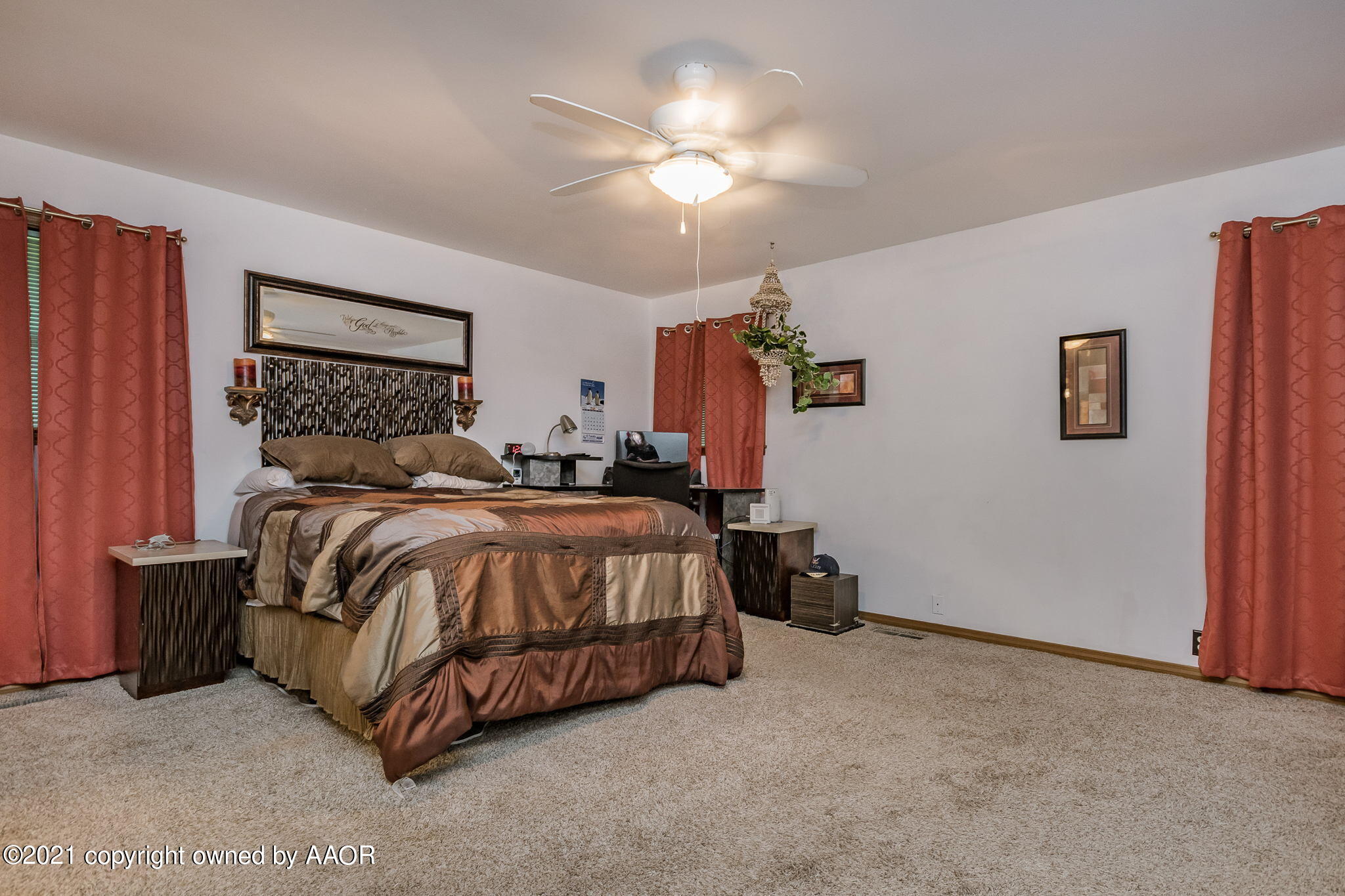 6909 Elmhurst Road Amarillo, TX 79106 - Photo 13 of 23 a bedroom with a bed and a chandelier