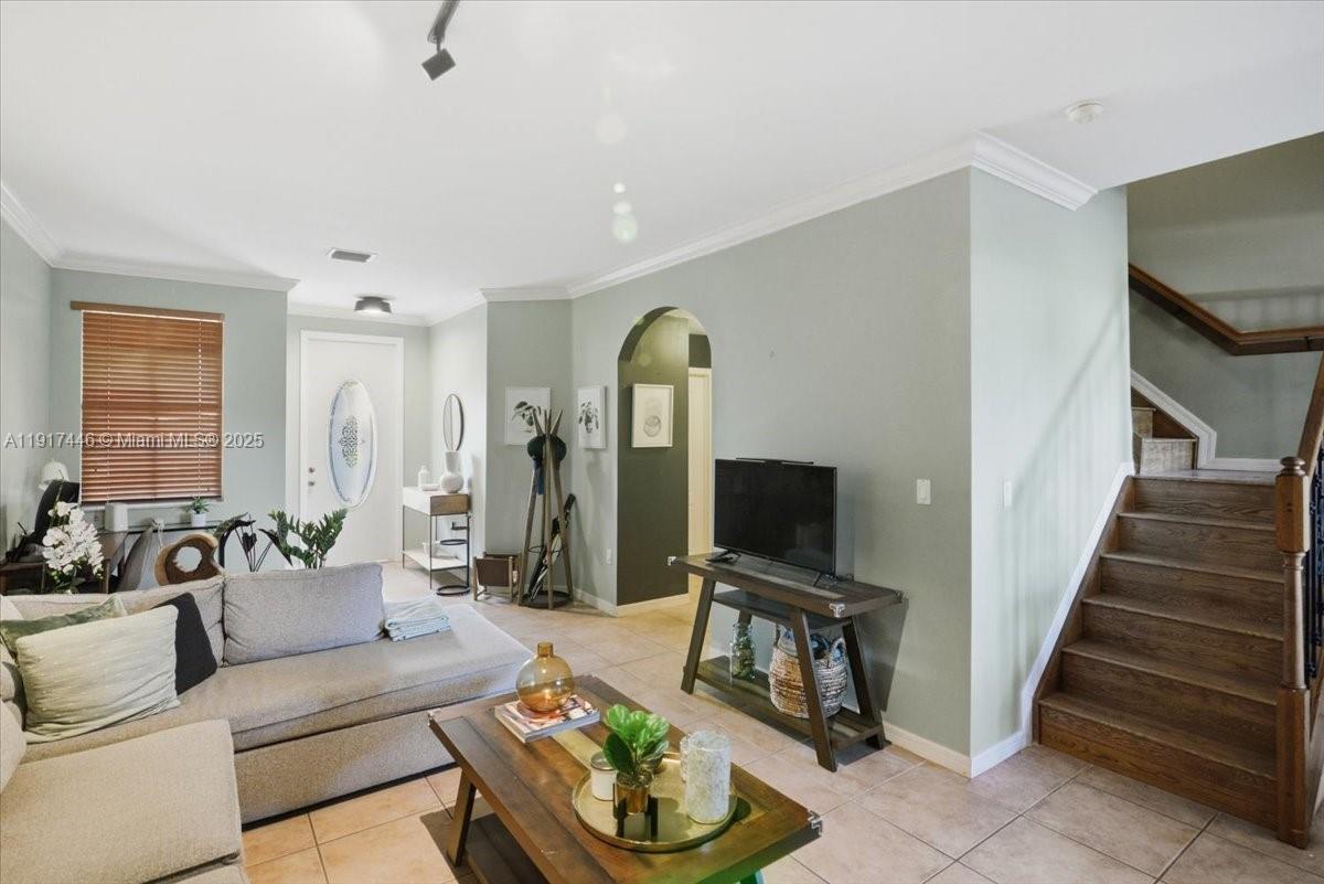 10891 Southwest 88th Terrace Miami, FL 33176 - Photo 16 of 41 a living room with furniture and a flat screen tv