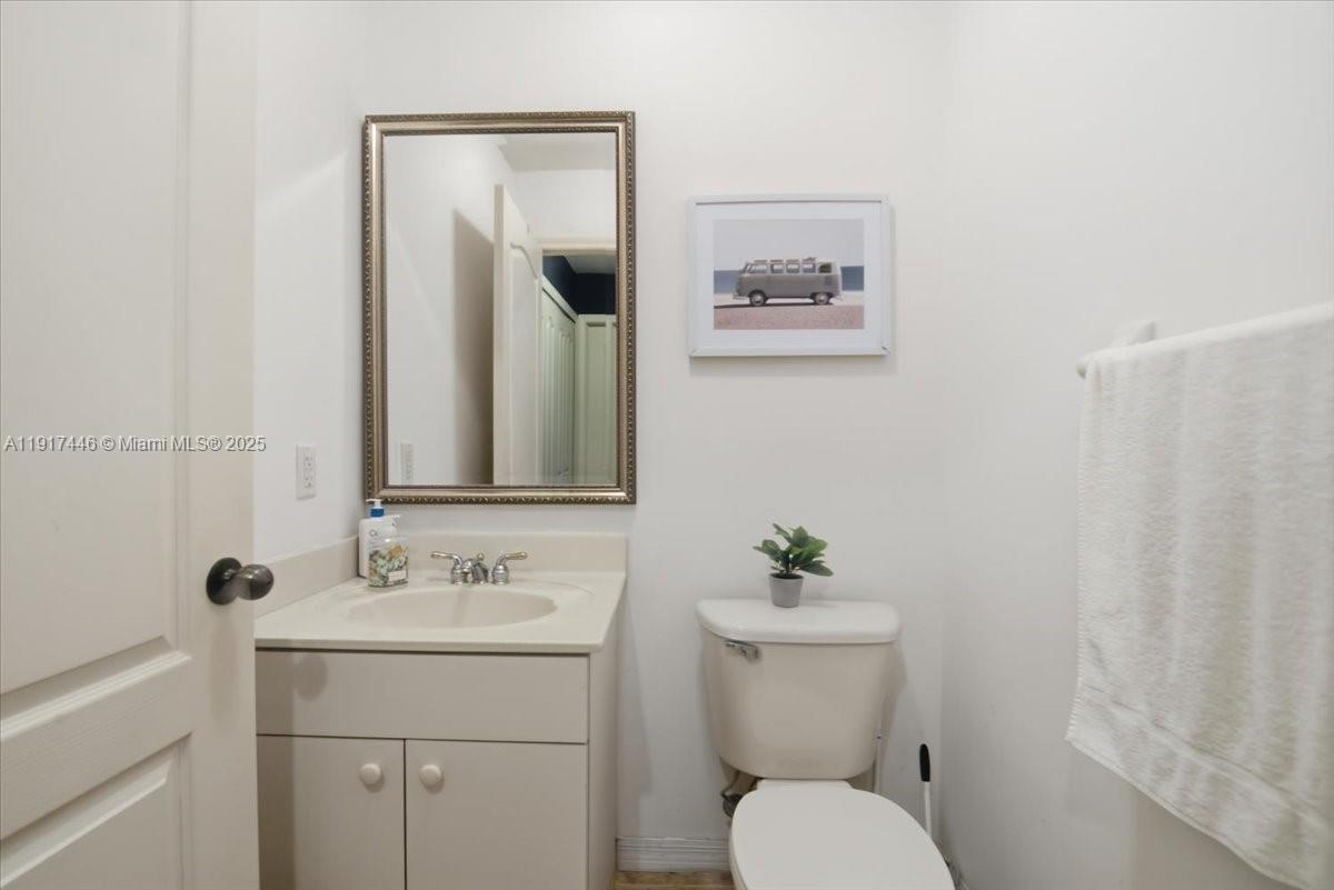 10891 Southwest 88th Terrace Miami, FL 33176 - Photo 29 of 41 a bathroom with a toilet sink and mirror