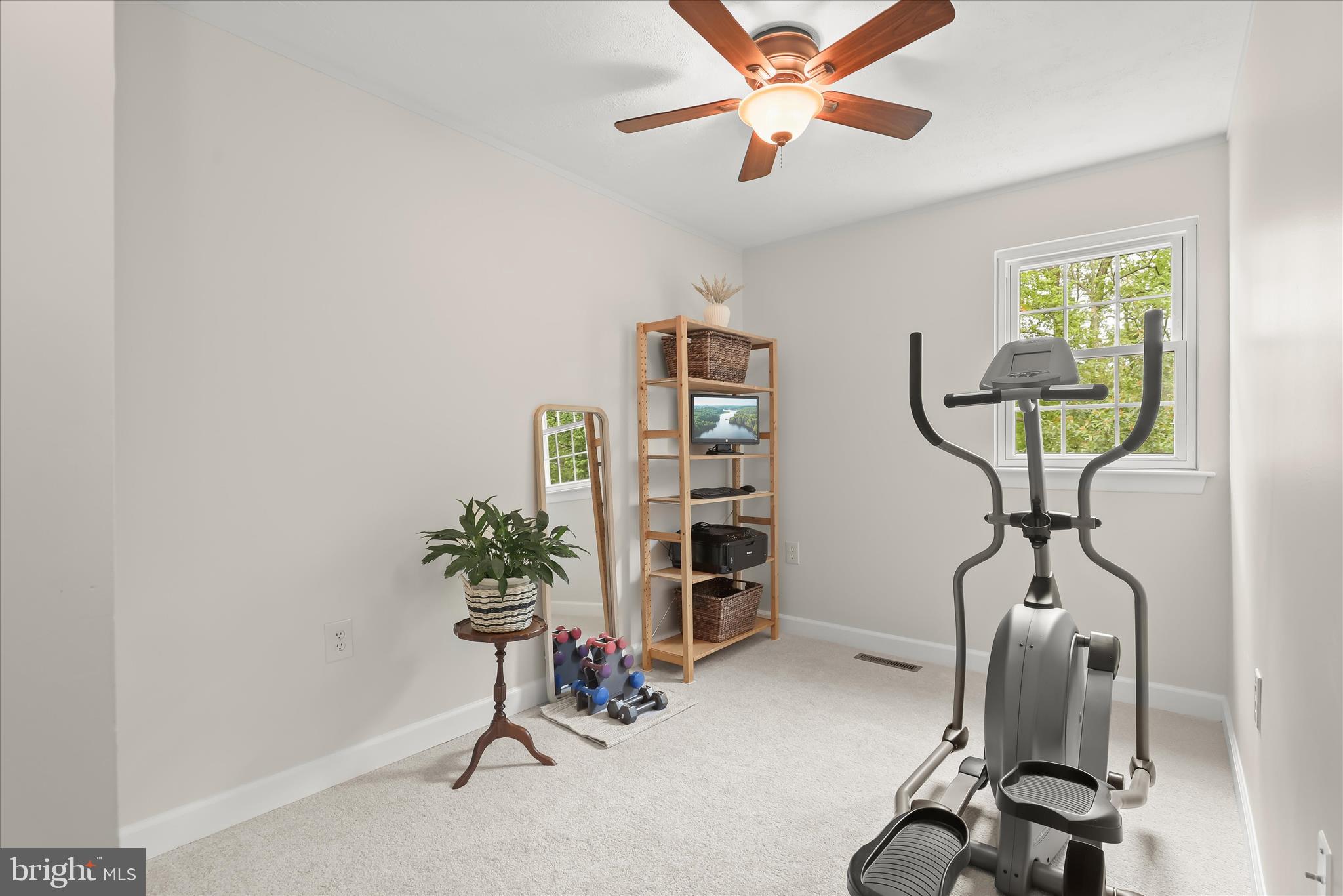 792 Match Point Drive Arnold, MD 21012 - Photo 12 of 43 a view of a workspace with furniture and a potted plant