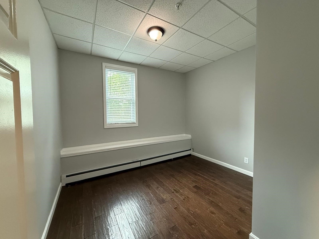 690 Lawrence Street, Unit 1 Lowell, MA 01852 - Photo 5 of 8 a view of room and window