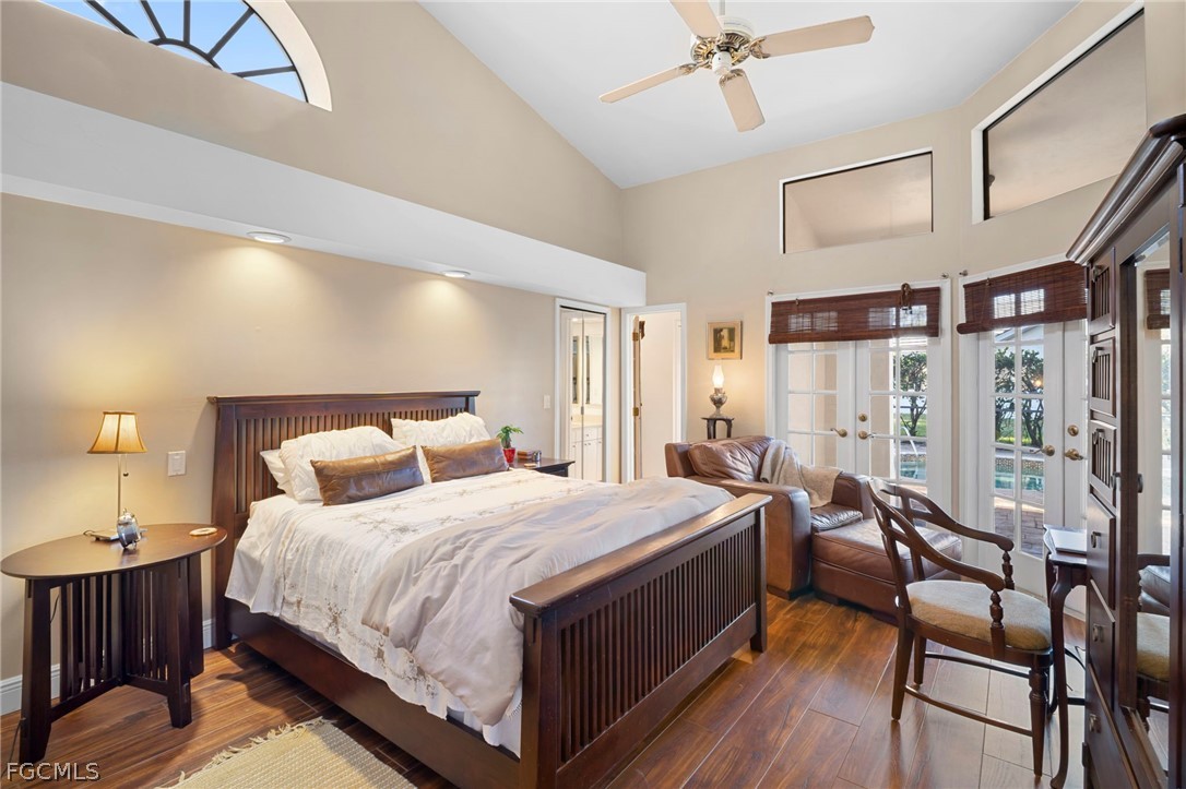 11772 Mahogany Run Fort Myers, FL 33913 - Photo 36 of 50 a bedroom with a bed and a chandelier