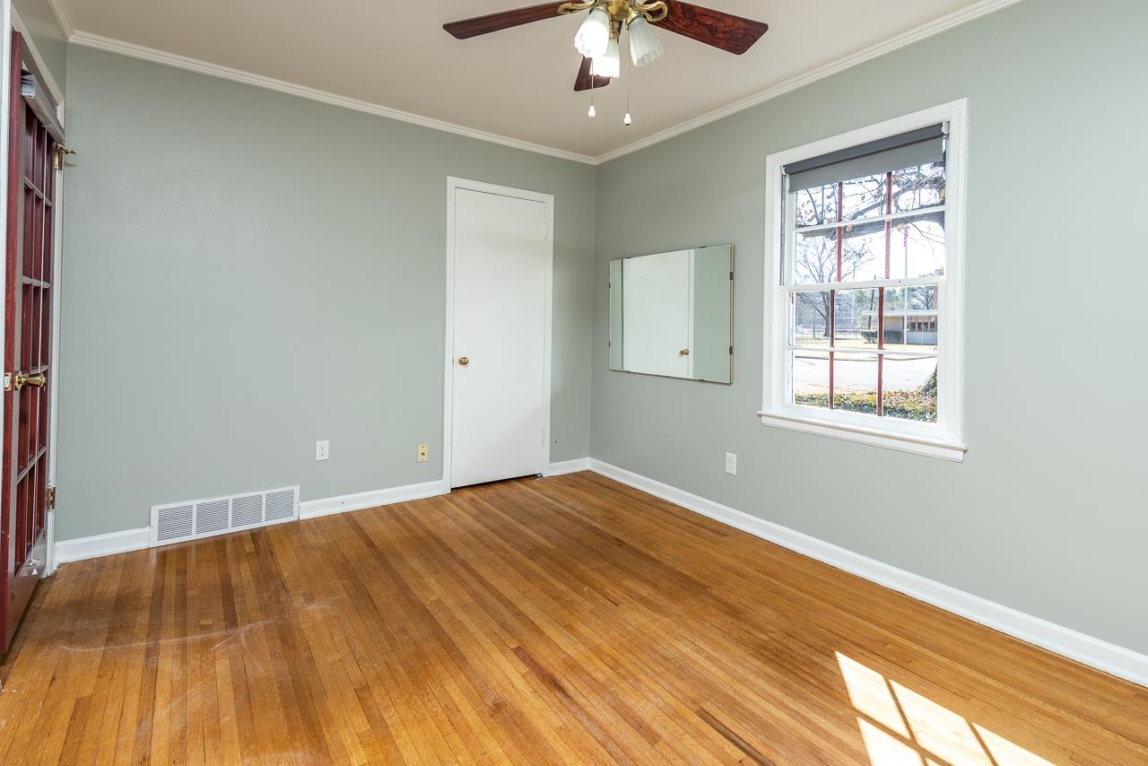 4734 Willow Road Memphis, TN 38117 - Photo 5 of 23 a view of empty room with wooden floor and fan