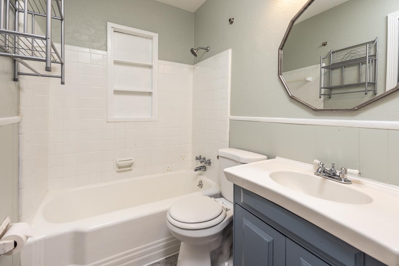 4734 Willow Road Memphis, TN 38117 - Photo 6 of 23 a bathroom with a sink a toilet and a mirror