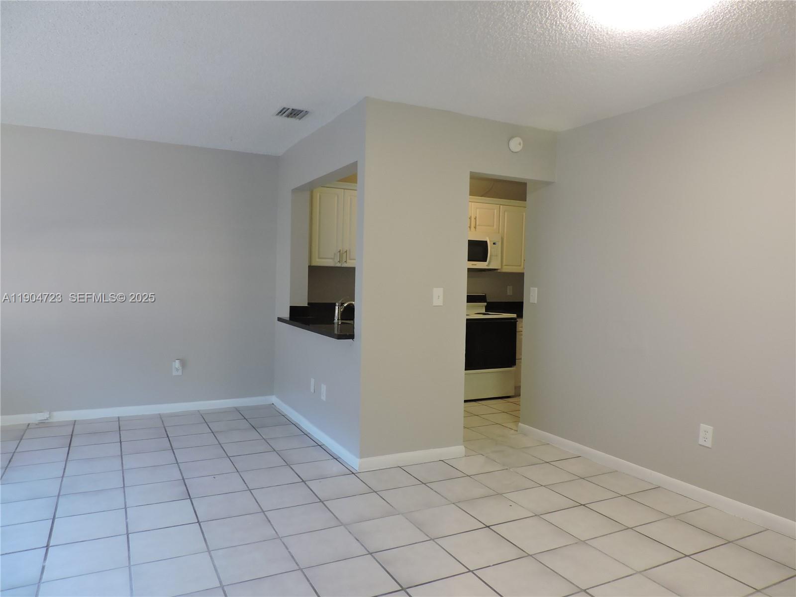 14867 Southwest 104th Street, Unit 2421 Miami, FL 33196 - Photo 16 of 18 a view of an empty room