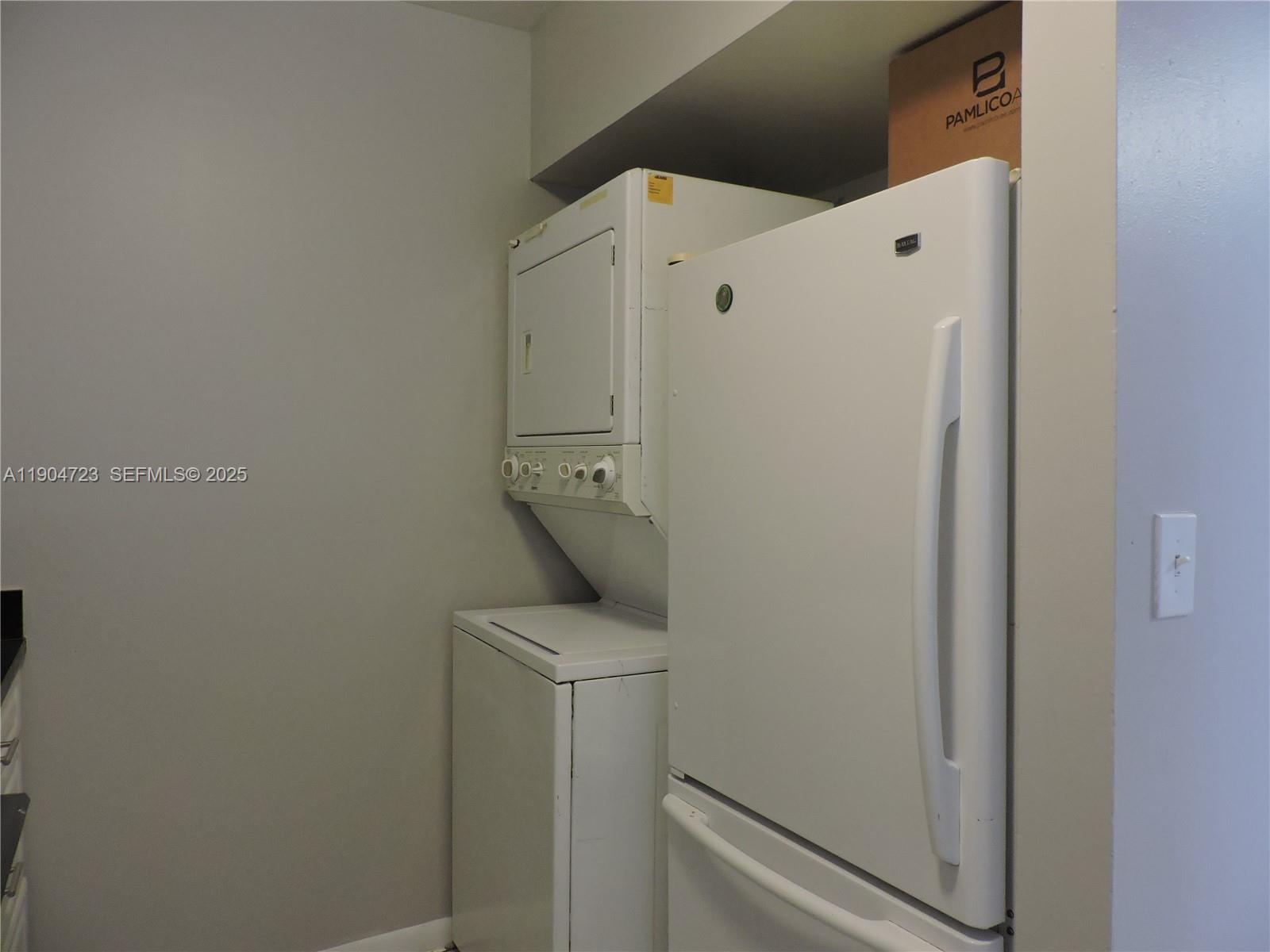 14867 Southwest 104th Street, Unit 2421 Miami, FL 33196 - Photo 3 of 18 a utility room with dryer and washer