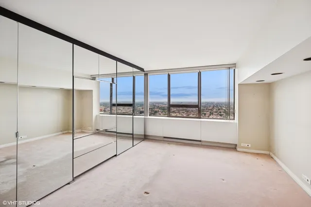 a view of an empty room with a sliding door
