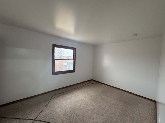 910 East 152nd Place Phoenix, IL 60426 - Photo 16 of 28 an empty room with a window