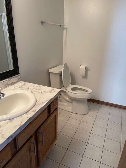 910 East 152nd Place Phoenix, IL 60426 - Photo 21 of 28 a bathroom with a granite countertop sink and a toilet