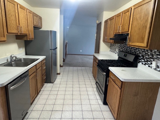 910 East 152nd Place Phoenix, IL 60426 - Photo 10 of 28 a kitchen with a sink stove and refrigerator