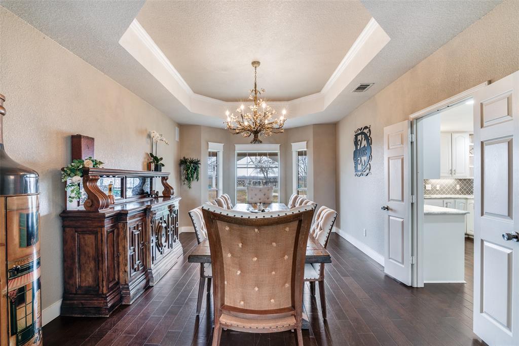 19930 County Road 324 Terrell, TX 75160 - Photo 11 of 40 a view of a dining room with furniture a chandelier and wooden floor