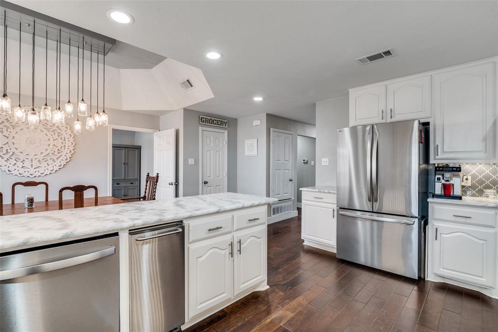 19930 County Road 324 Terrell, TX 75160 - Photo 15 of 40 a kitchen with stainless steel appliances granite countertop a refrigerator a sink and a stove