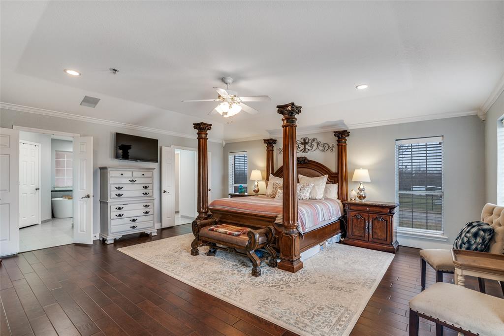 19930 County Road 324 Terrell, TX 75160 - Photo 18 of 40 a bedroom with furniture and wooden floor