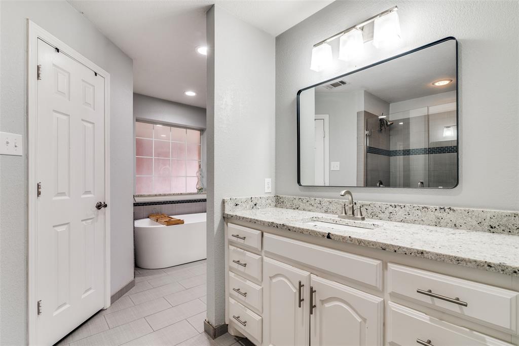 19930 County Road 324 Terrell, TX 75160 - Photo 19 of 40 a bathroom with a granite countertop sink mirror and double