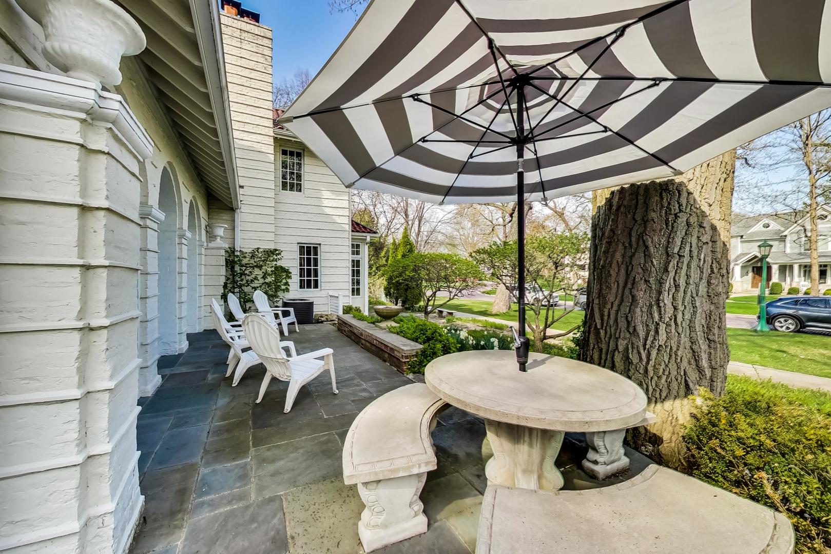 32 Crescent Place Wilmette, IL 60091 - Photo 38 of 45 a view of a patio with a table chairs and a backyard