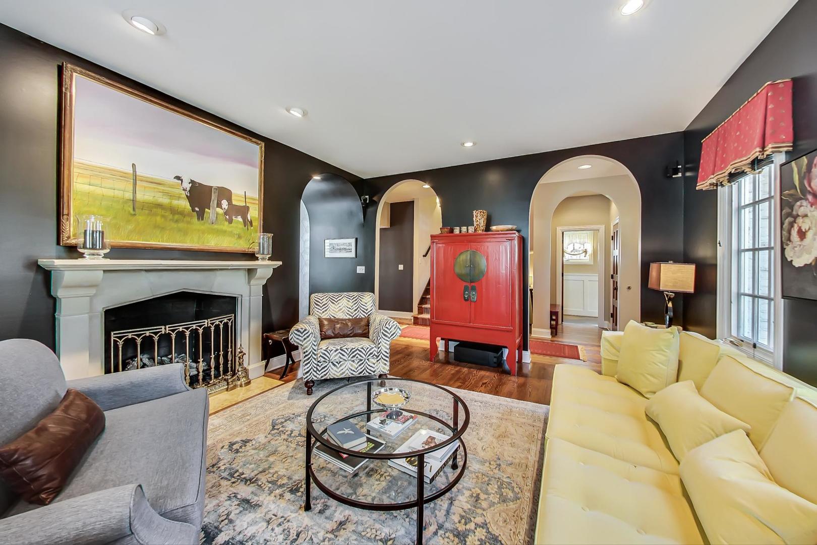 32 Crescent Place Wilmette, IL 60091 - Photo 6 of 45 a living room with furniture a fireplace and a flat screen tv