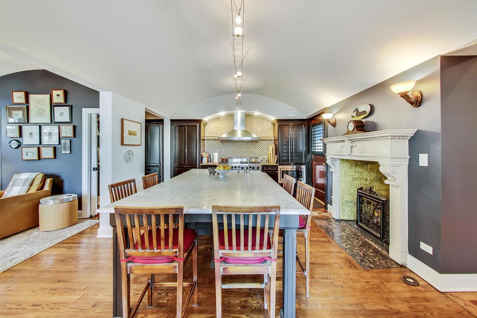 32 Crescent Place Wilmette, IL 60091 - Photo 8 of 45 a dining room with furniture a rug and wooden floor