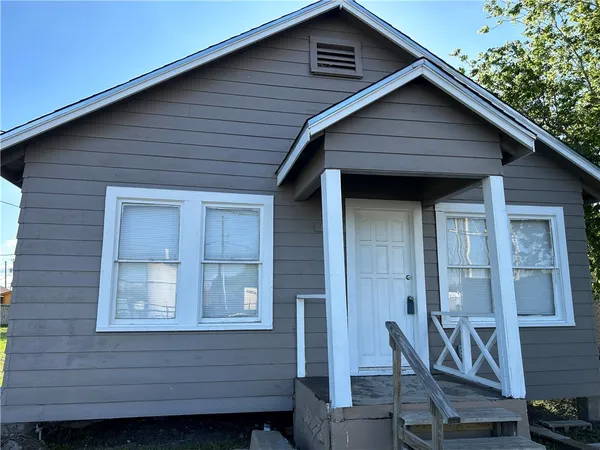 a front view of a house with a glass windows