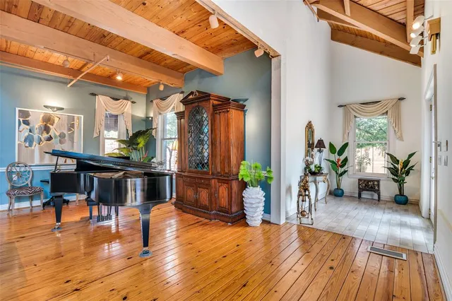 a view of a living room and kitchen with furniture