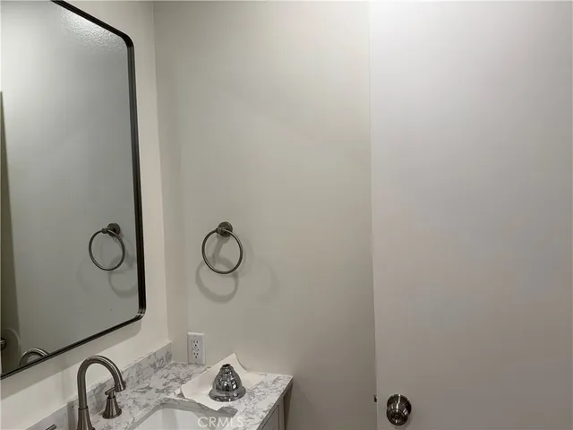 a bathroom with a sink and mirror