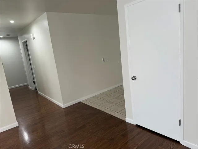 an empty room with wooden floor