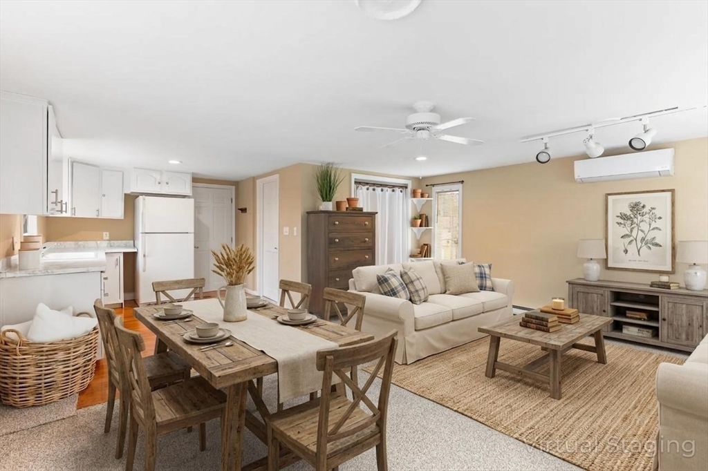 17 Weaver Street Wareham, MA 02576 - Photo 30 of 37 a living room with fireplace furniture and a table