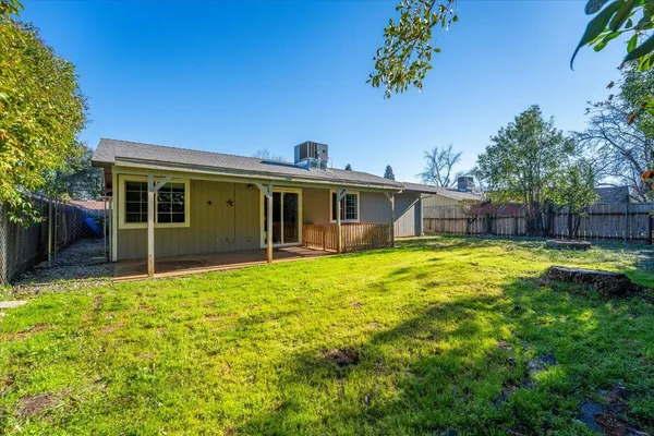 a house view with a sitting space and garden