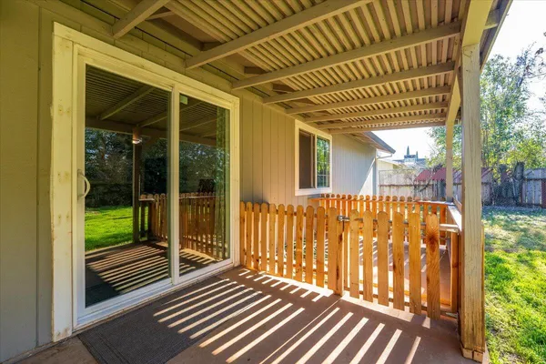 a view of balcony with wooden floor