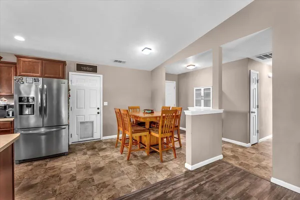 a kitchen with a table and chairs in it
