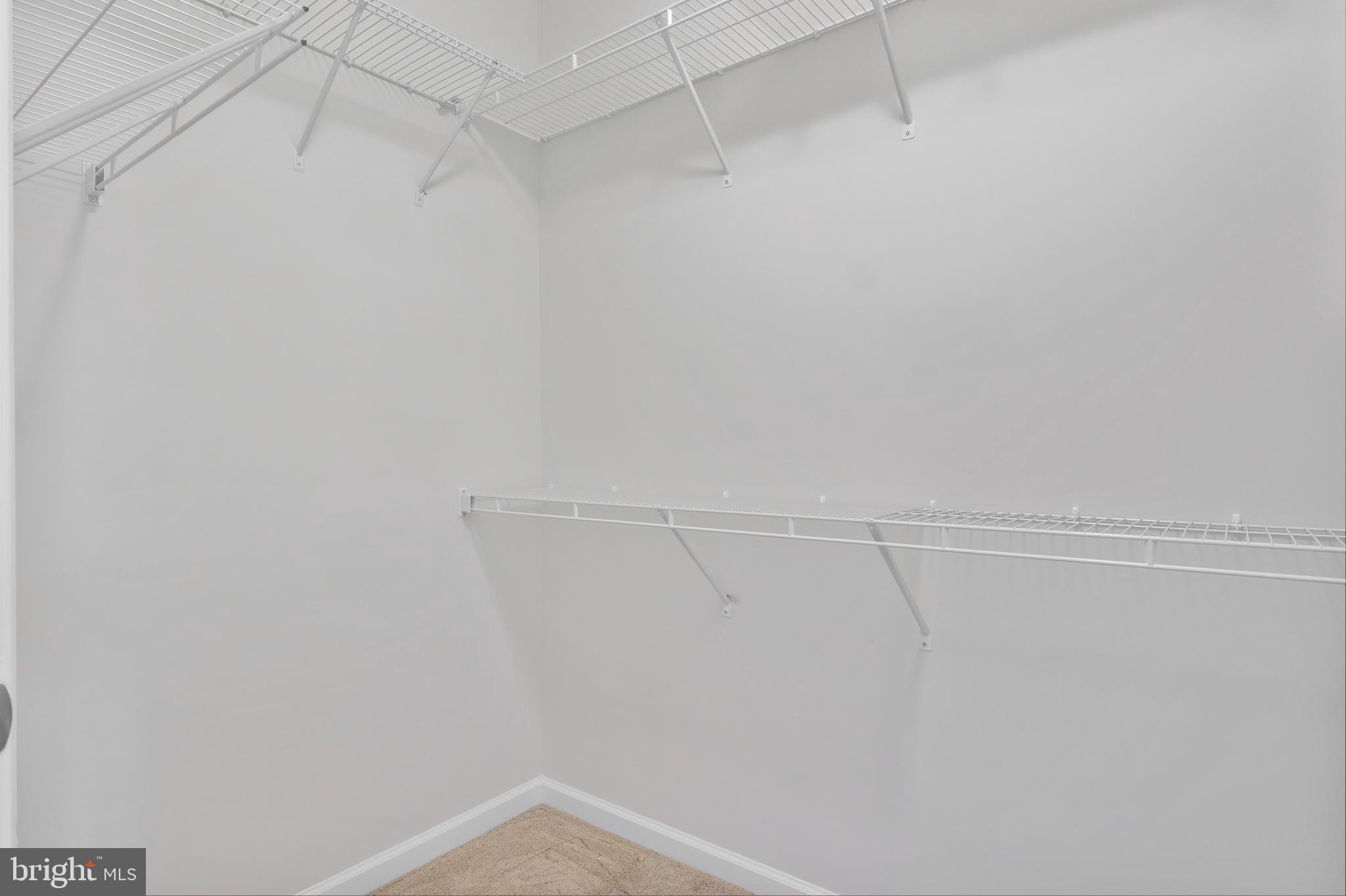 20655 Hope Spring Terrace, Unit 403 Ashburn, VA 20147 - Photo 11 of 21 a view of a room with racks on the wall