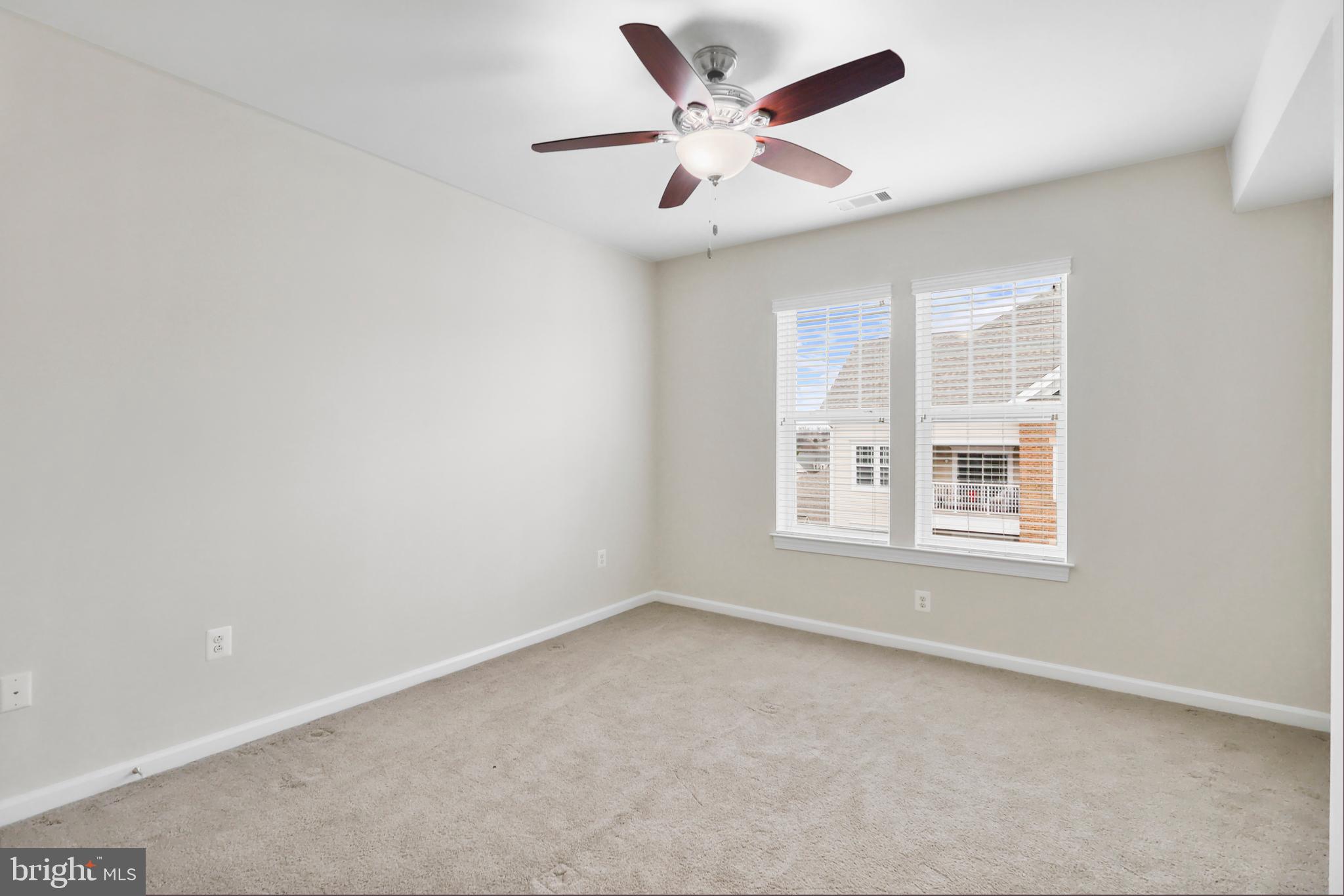 20655 Hope Spring Terrace, Unit 403 Ashburn, VA 20147 - Photo 14 of 21 an empty room with a window