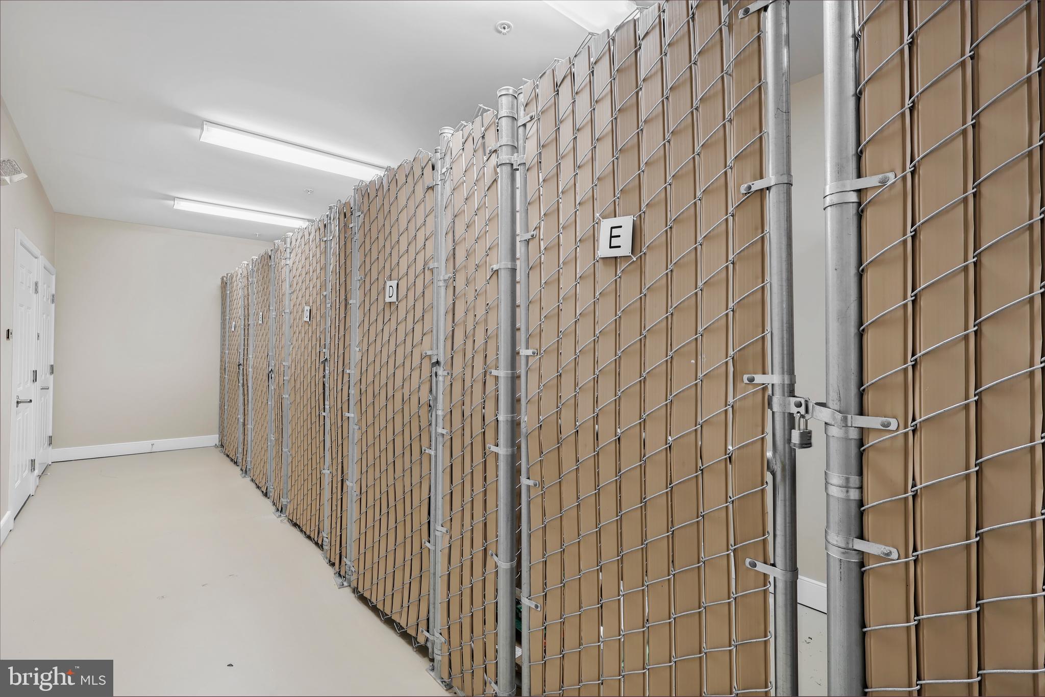 20655 Hope Spring Terrace, Unit 403 Ashburn, VA 20147 - Photo 20 of 21 a view of a bathroom with a shower curtain
