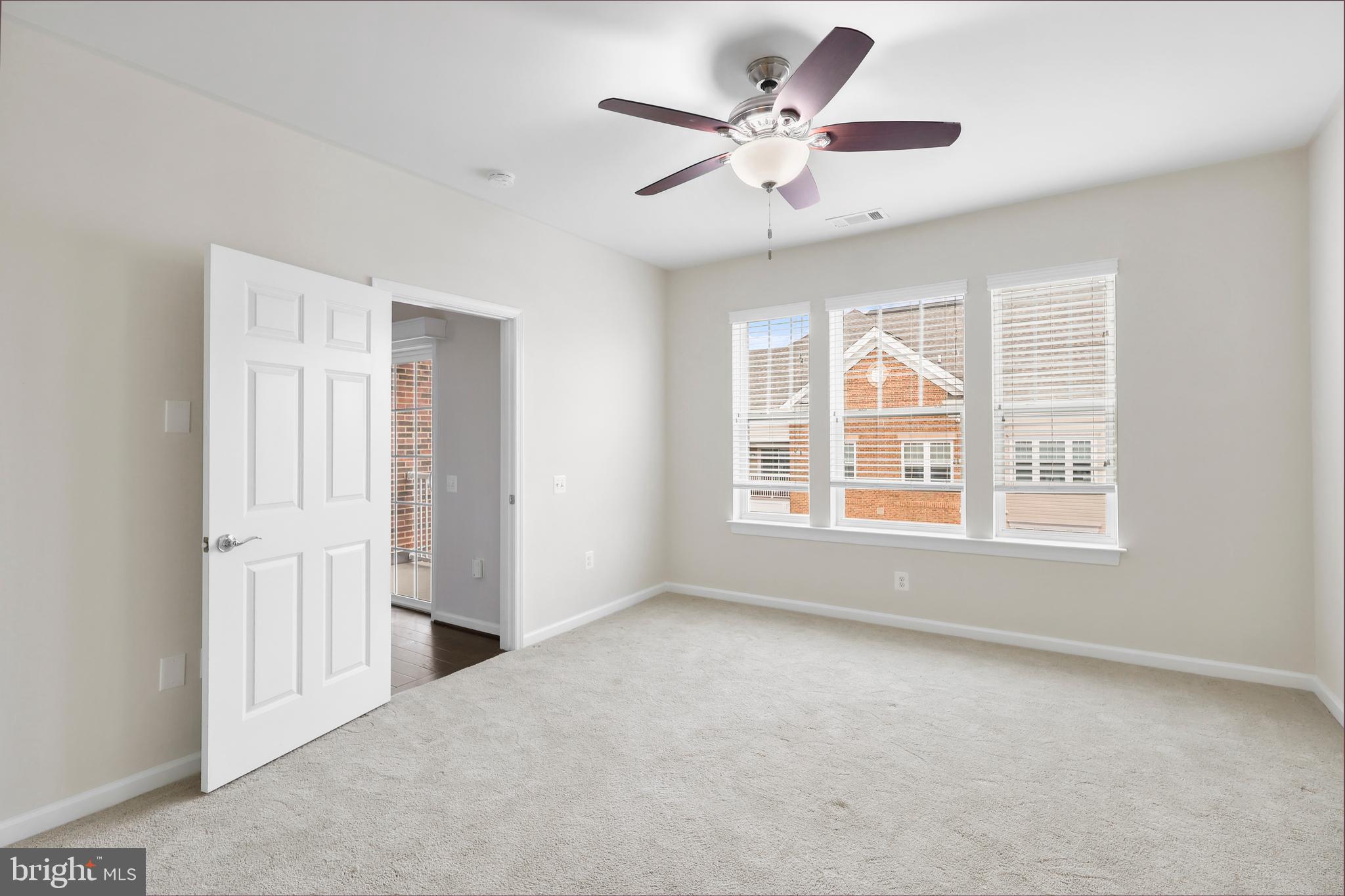 20655 Hope Spring Terrace, Unit 403 Ashburn, VA 20147 - Photo 9 of 21 a view of an empty room with a window