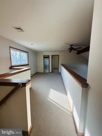 a view of a livingroom with furniture and windows