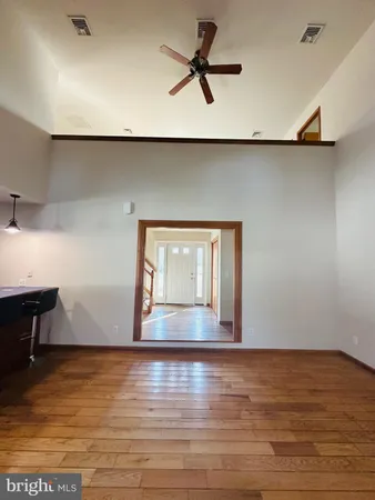 a view of room with window and wooden floor