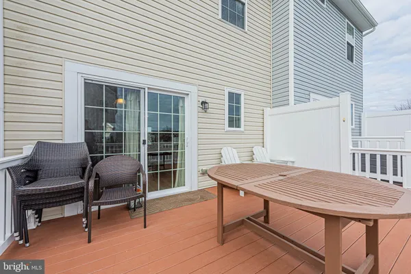 a view of a dinning table and chairs in the roof deck