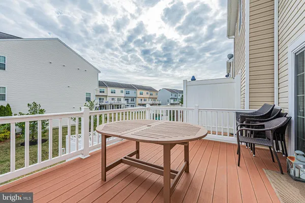 a view of a balcony with furniture