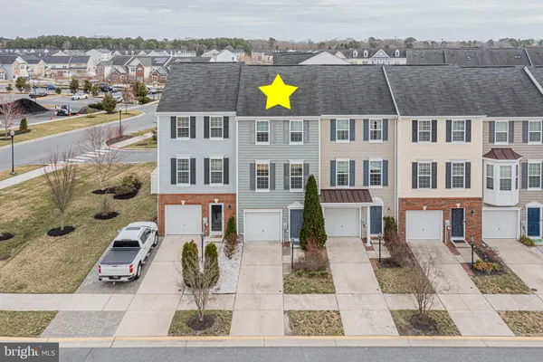 an aerial view of a city with ocean view
