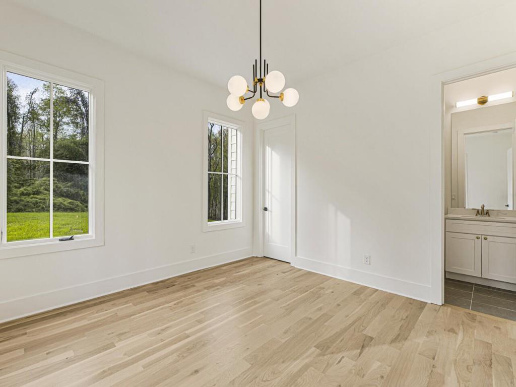 2000 Birmingham Road Milton, GA 30004 - Photo 12 of 42 a view of an empty room with a window and wooden floor