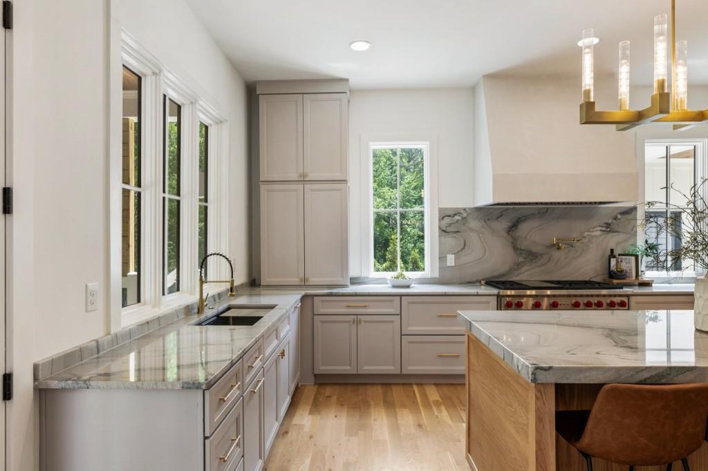 2000 Birmingham Road Milton, GA 30004 - Photo 20 of 42 a kitchen with stainless steel appliances granite countertop a sink a stove and a refrigerator