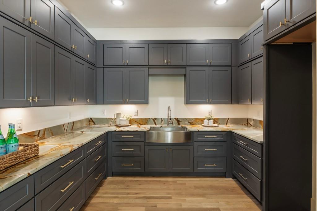 2000 Birmingham Road Milton, GA 30004 - Photo 25 of 42 a kitchen with stainless steel appliances granite countertop a sink and cabinets
