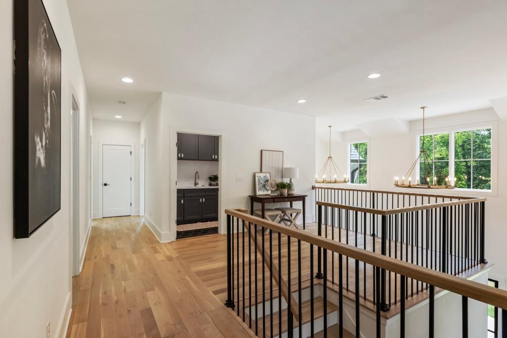 2000 Birmingham Road Milton, GA 30004 - Photo 28 of 42 a view of a hallway with wooden floor and windows