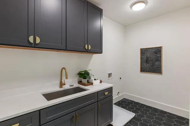 a kitchen with a sink and cabinets