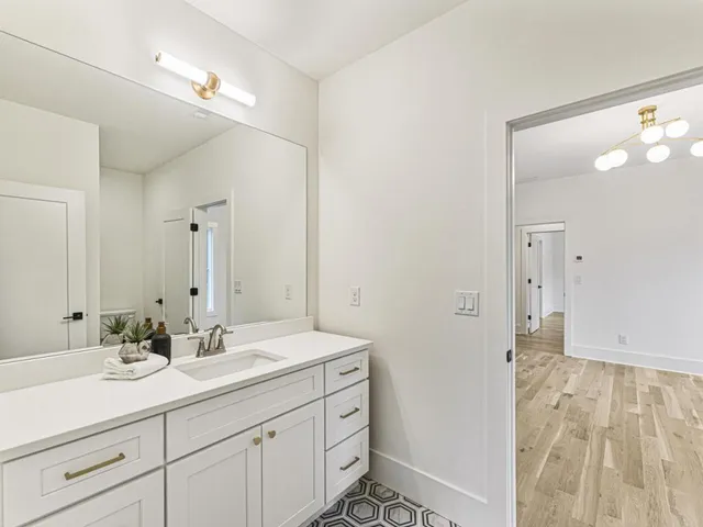 a bathroom with a sink double vanity and a mirror