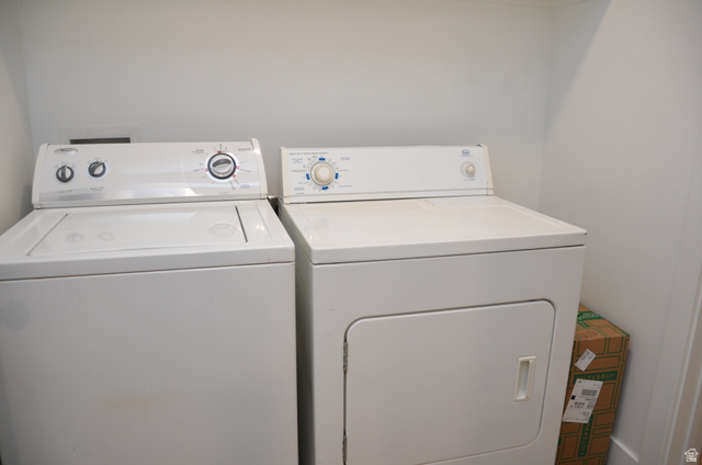 1842 South 1280th Street West Logan, UT 84321 - Photo 18 of 21 Dedicated laundry space featuring a white top-load washing machine and a white front-load dryer