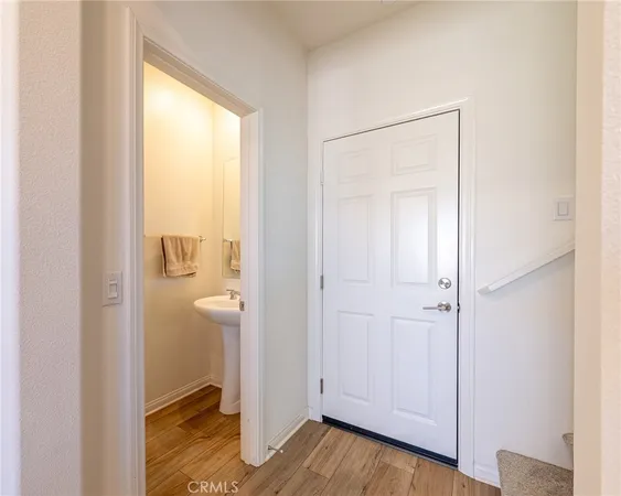 a view of an empty room and wooden floor