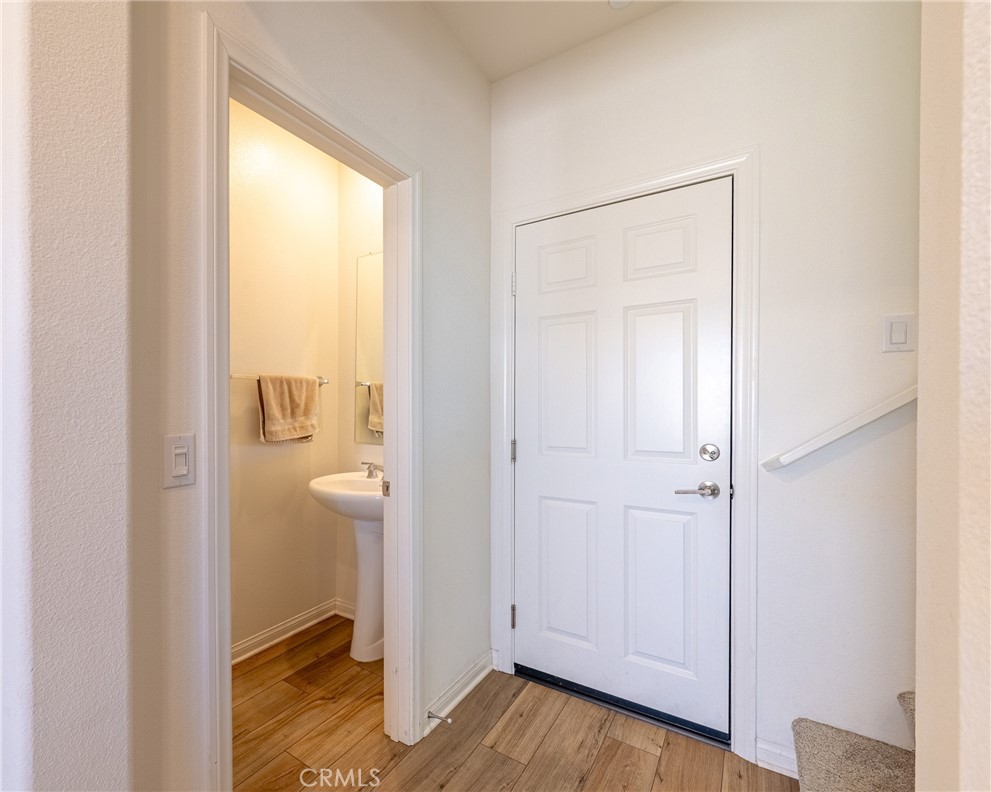 202 Bonita Lane Rialto, CA 92376 - Photo 15 of 43 a view of an empty room and wooden floor